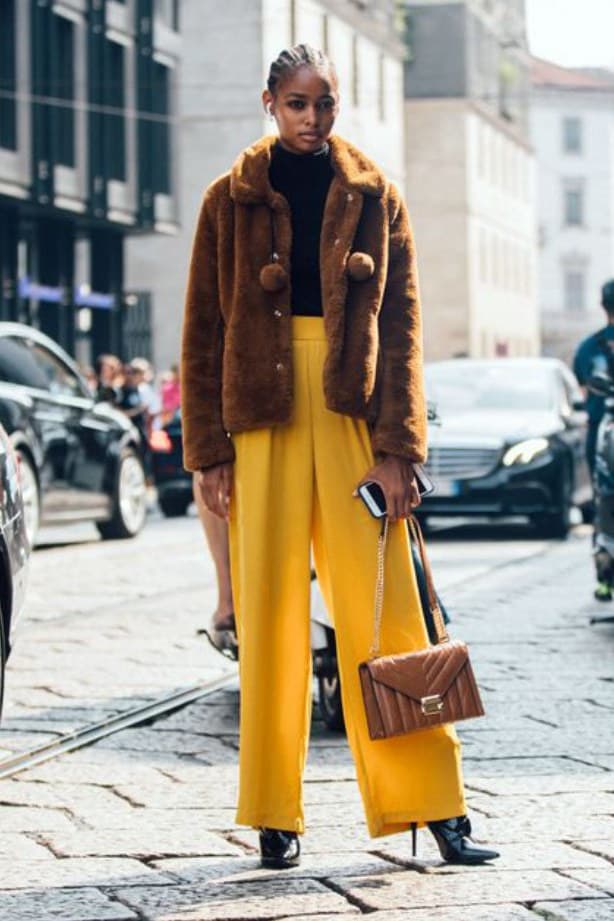 Brown coat with pale yellow pants