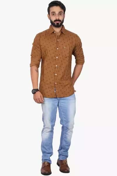 Tan shirt paired with light blue jeans